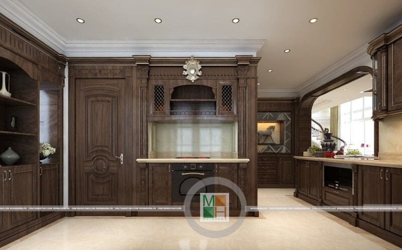 Thiết kế nội thất phòng bếp chung cư tân cổ điển với hệ tủ bếp gỗ tự nhiên màu nâu trầm mang đến vẻ đẹp sang trọng, đẳng cấp cho căn phòng. Thiết kế phòng bếp đẹp